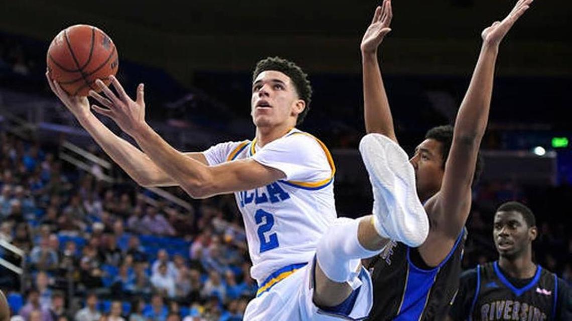 UCLA guard Lonzo Ball, left, shoots as UC Riverside forward Brandon Rosser defends during the second half of the Bruins’ 98-56 win on Wednesday, Nov. 30, 2016, in Los Angeles. UCLA won 98-56. Mark J. Terrill AP Photo