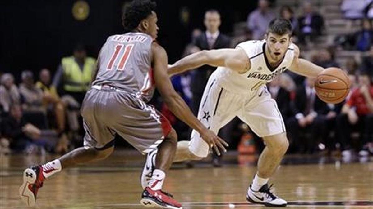 Vanderbilt guard Camron Justice (0) is defended by Gardner-Webb guard David Efianayi (11) in the second half of an NCAA college basketball game Monday, Nov. 16, 2015, in Nashville, Tenn. Vanderbilt won 98-62.