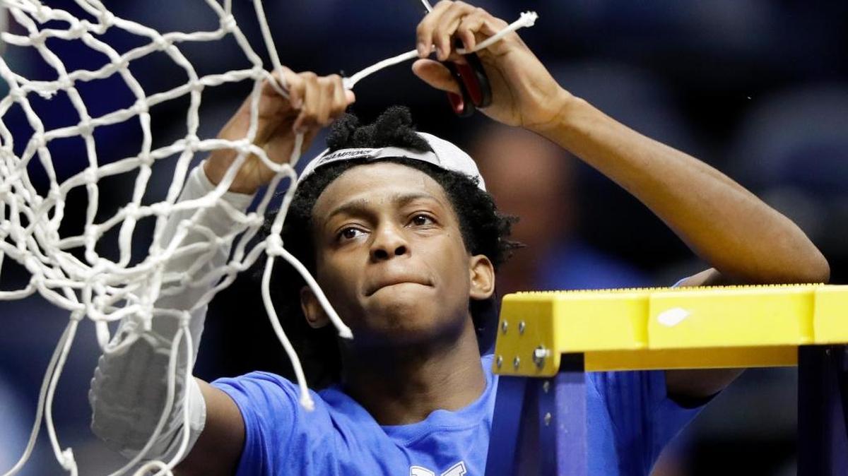 Kentucky guard De’Aaron Fox cuts down the net after Kentucky beat Arkansas 82-65 to win the SEC Tournament championship on Sunday, March 12, 2017, in Nashville, Tenn. Fox was named the tournament’s MVP.