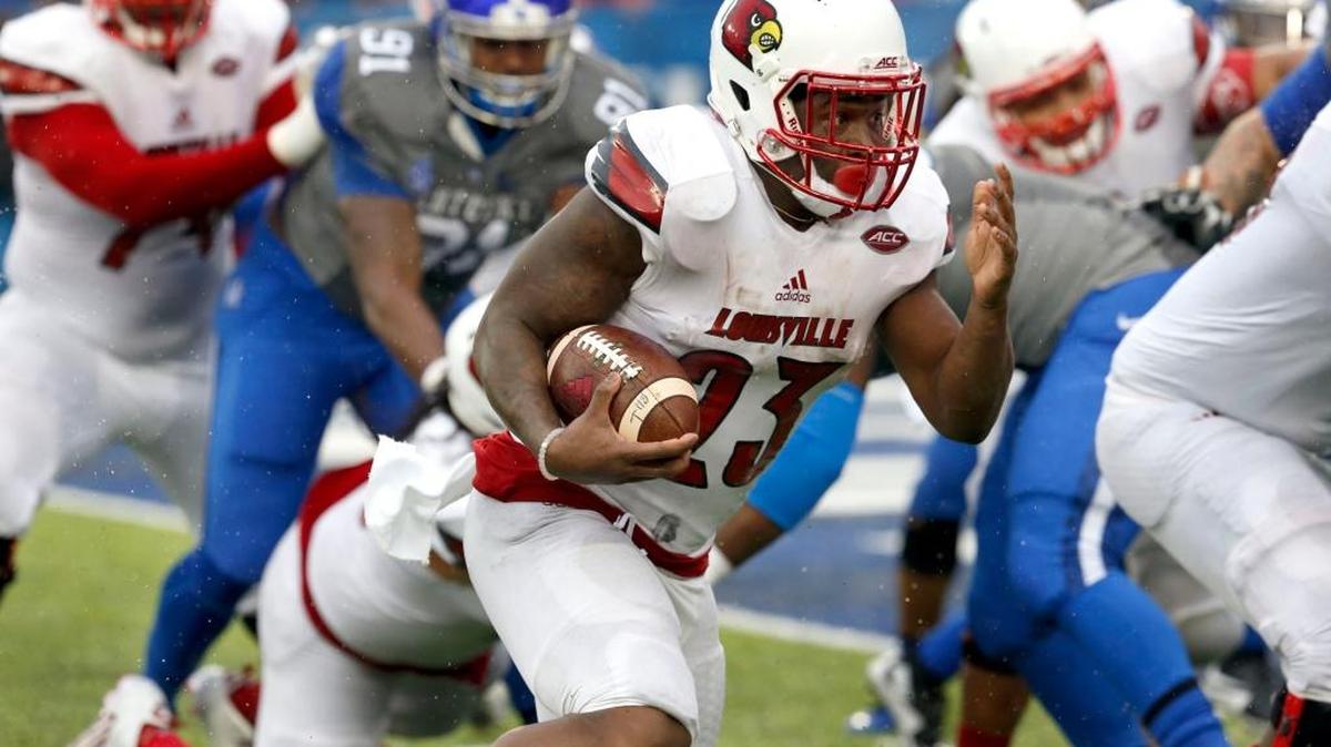 Louisville Cardinals running back Brandon Radcliff (23) scored the winning touchdown on a run as the University of Kentucky played the University of Louisville at Commonwealth Stadium in Lexington, Ky., Saturday, November 28, 2015. This is fourth quarter action. Louisville won 38-24.