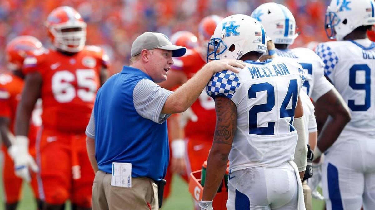 Kentucky head coach Mark Stoops talks to defensive Blake McClain (24) during UK’s 45-7 loss at Florida on Saturday, September 10, 2016.