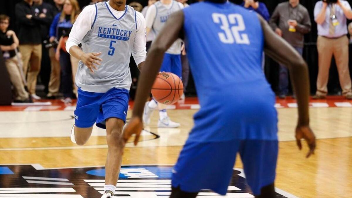 Kentucky guard Malik Monk (5) drove on forward Wenyen Gabriel (32) as the University of Kentucky men’s basketball team practiced for their first round NCAA tournament game in Bankers Life Fieldhouse in Indianapolis, In., Thursday, March16, 2017.