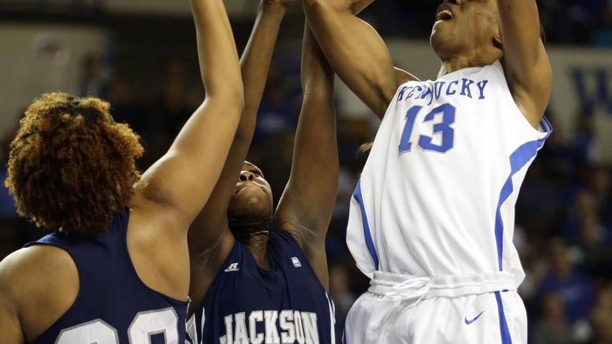 Kentucky forward Evelyn Akhator (13) is fouled by Jackson State forward Nyahok Bile (22) as she scores during the first half Sunday, Nov. 29, 2015 in Lexington, Ky.