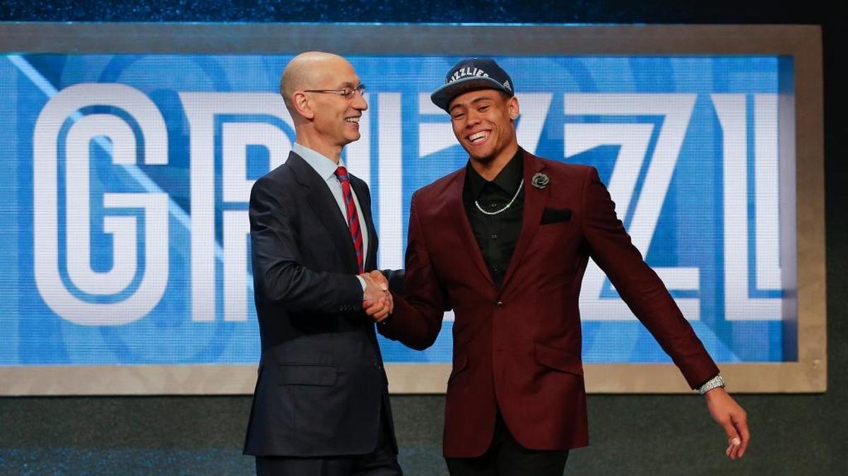NBA Commissioner Adam Silver, left, congratulates Wade Baldwin IV after he was selected 17th overall by the Memphis Grizzlies during the NBA basketball draft, Thursday, June 23, 2016, in New York.