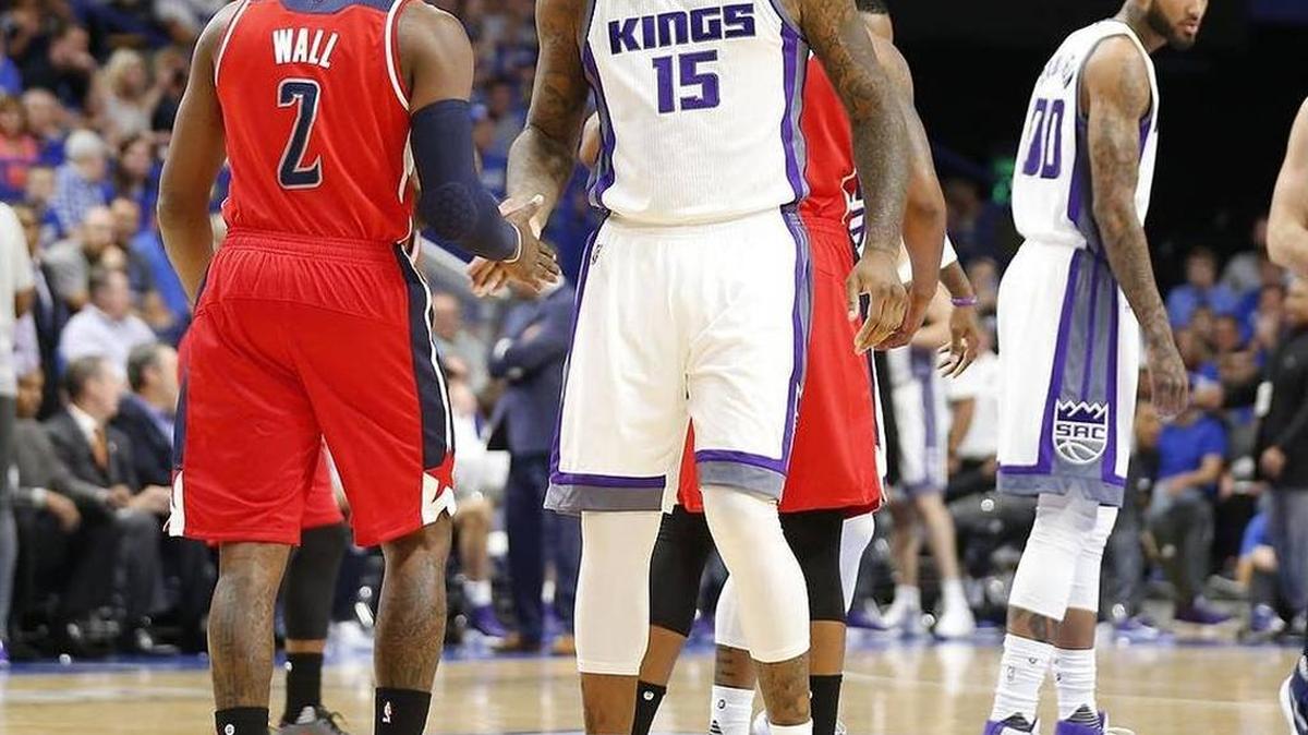 Washington Wizards guard John Wall (2) shook hands with Sacramento Kings center DeMarcus Cousins (15) in the first quarter as the Washington Wizards played the Sacramento Kings in a preseason game at Rupp Arena in Lexington, Ky., Saturday, October 15, 2016.