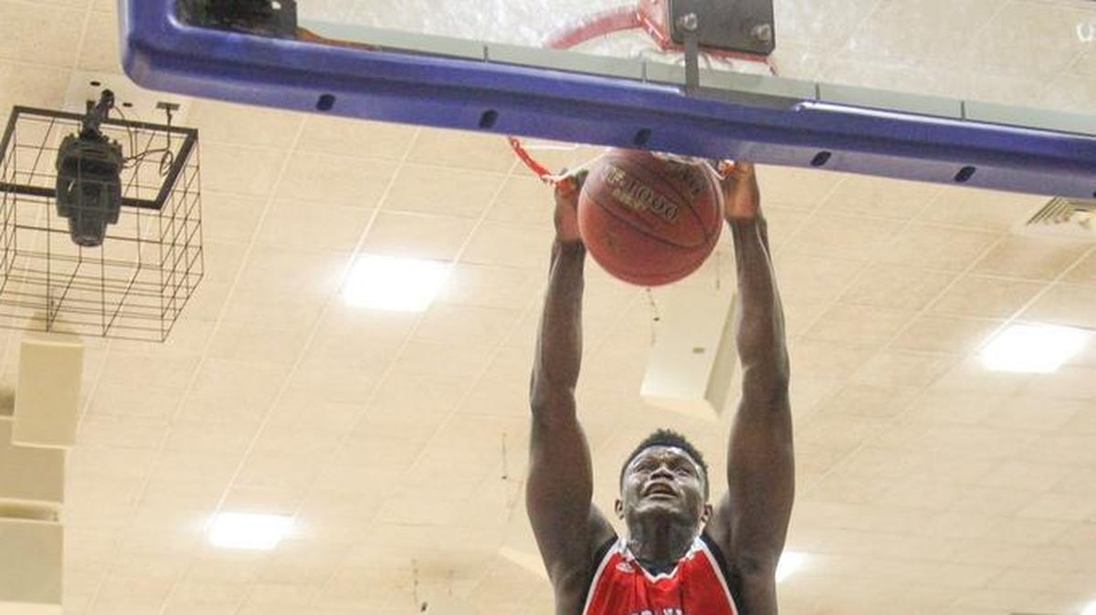Spartanburg Day High School’s Zion Williamson (12) dunks during the Chick-fil-A Classic at Richland Northeast High School on Dec. 20, 2016.
