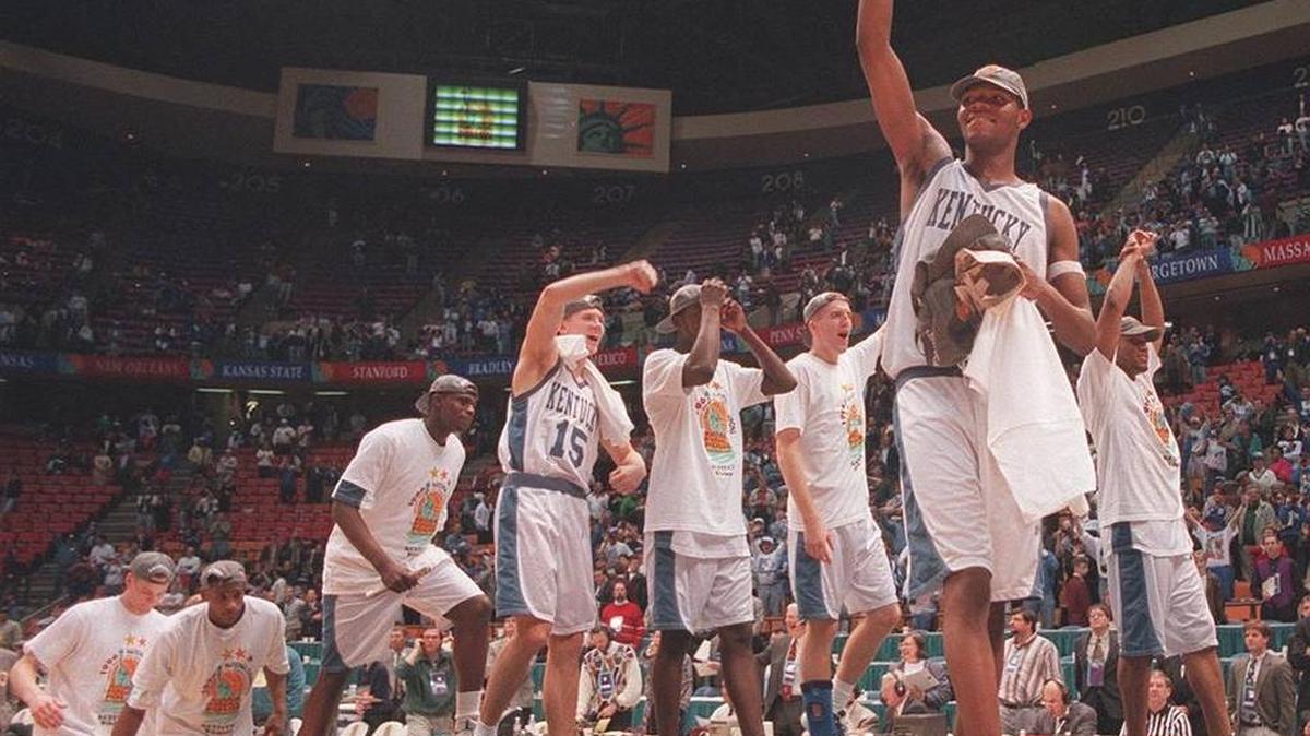 Walter McCarty leads the team on the podium after Kentucky defeated Syracuse in the 1996 NCAA Tournament championship game.