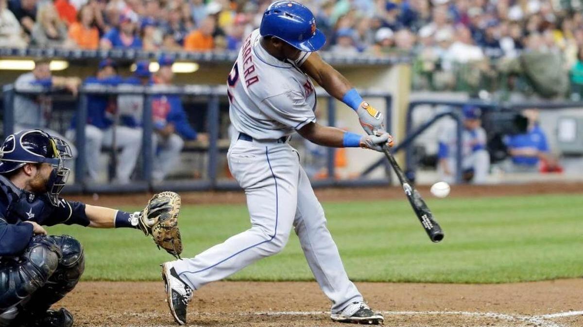 New York Mets’ Dilson Herrera hits a single during the seventh inning of a baseball game against the Milwaukee Brewers, in Milwaukee. The Mets traded Herrera to the Cincinnati Reds on Monday as part of a deal that included Jay Bruce.
