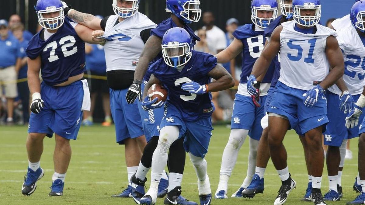 Jojo Kemp runs during an open practice for UK Football Fan Day on the new practice fields in Lexington, Ky., Saturday, August 6, 2016.