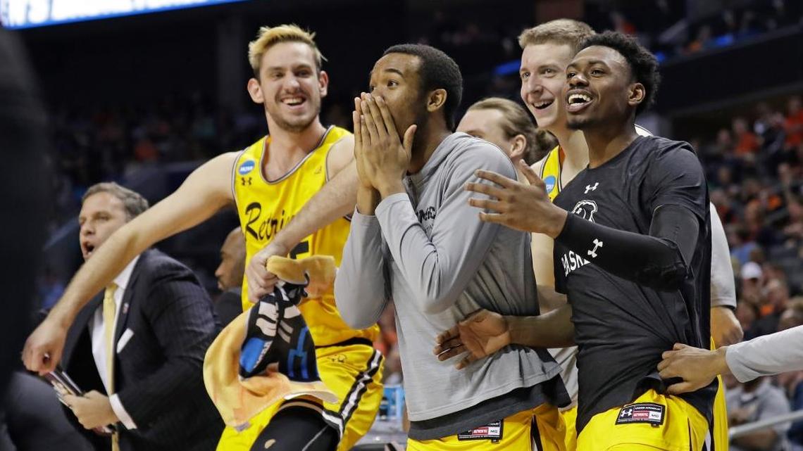 UMBC players celebrate a teammate’s basket against Virginia during the team’s 74-54 win in a first-round game in the NCAA men’s college basketball tournament in Charlotte, N.C., Friday, March 16, 2018.