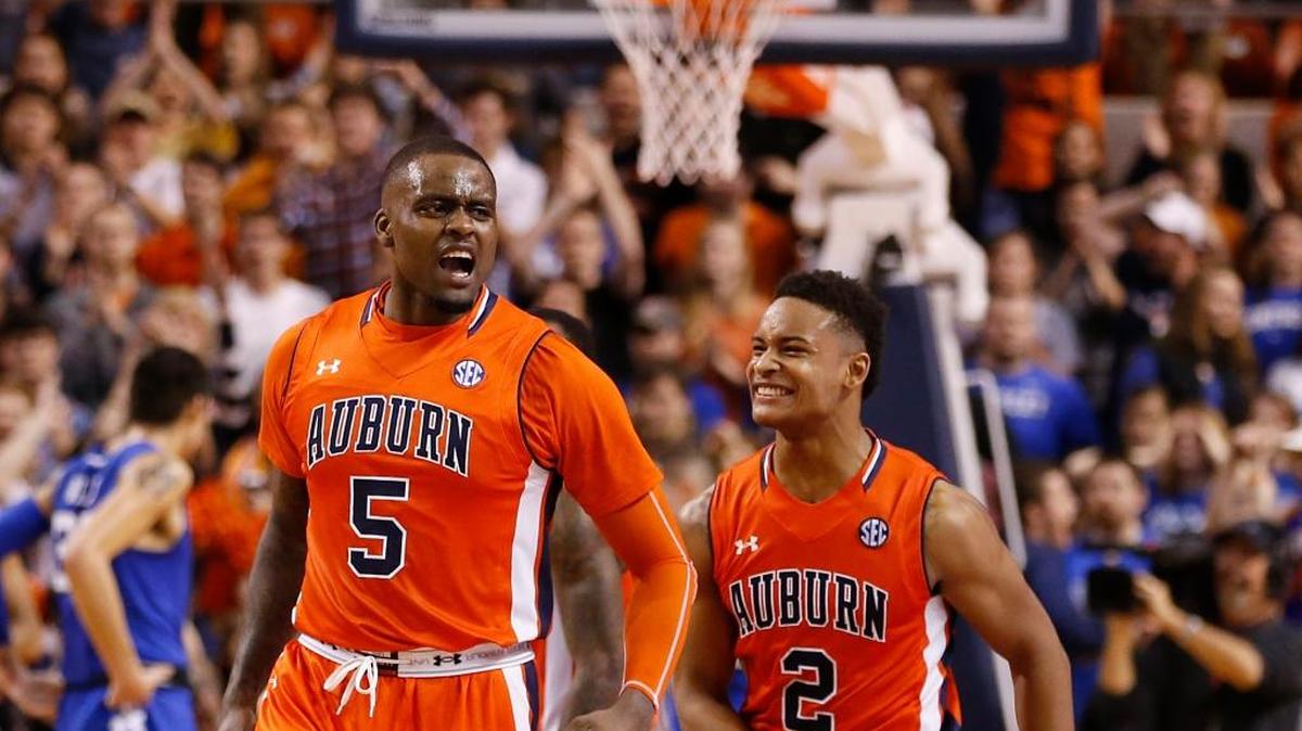 Auburn forward Cinmeon Bowers (5) and Auburn guard Bryce Brown (2) celebrate after beating Kentucky 75-70 during the second half of an NCAA college basketball game, Saturday, Jan. 16, 2016, in Auburn, Ala.