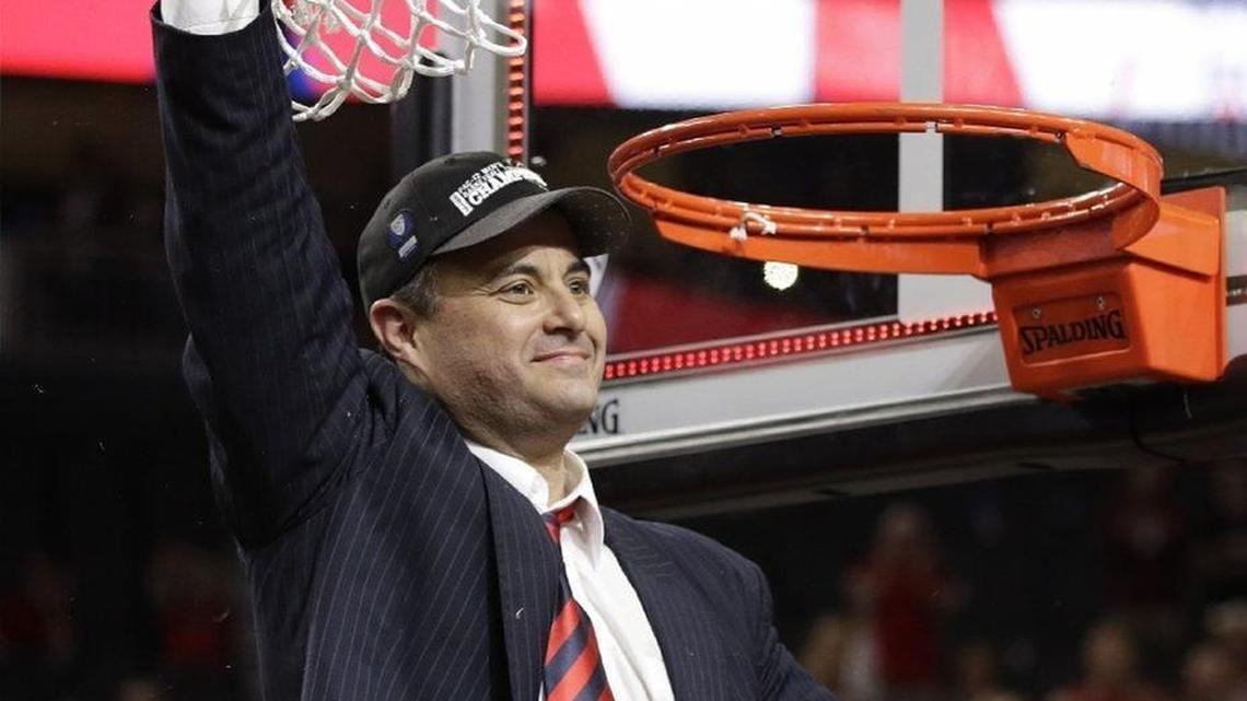 Arizona coach Sean Miller lifts the cut net after his Wildcats defeated Oregon 83-80 in the championship game of the 2017 Pac-12 Tournament in Las Vegas.