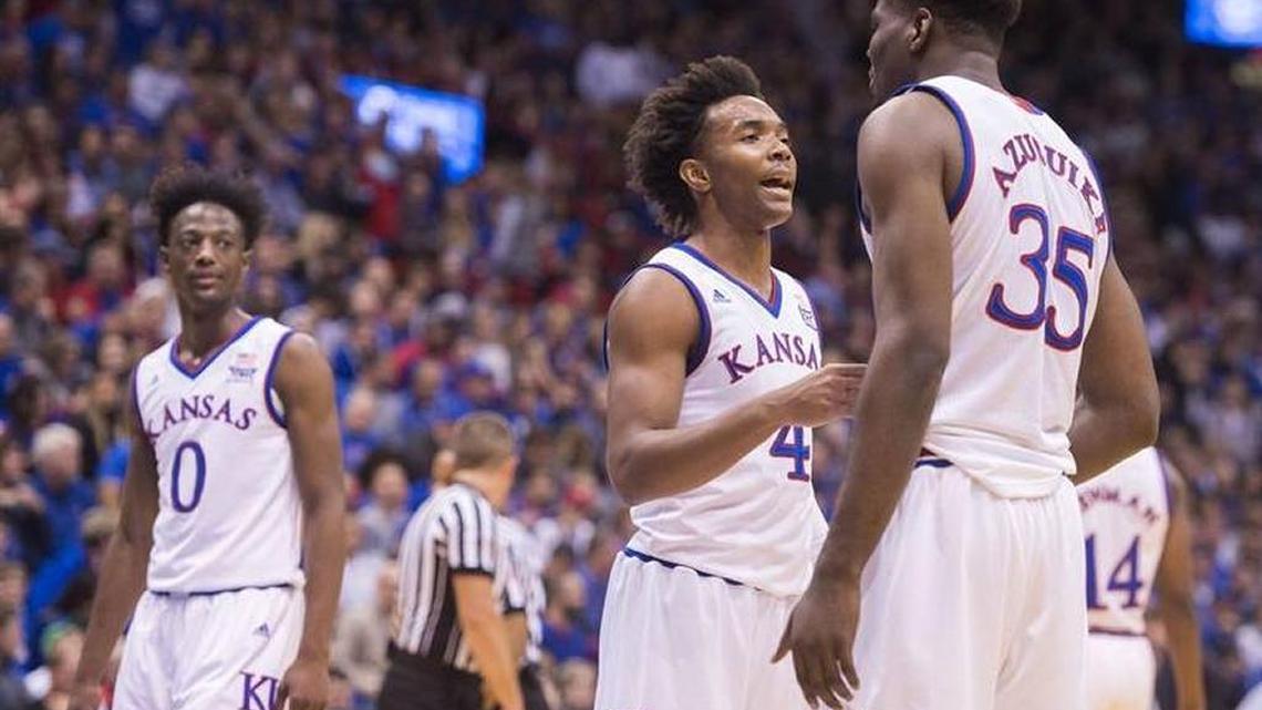 Kansas guard Devonte Graham (center) talked with teammate Udoka Azubuike in the first half of Kansas’ win over Tennessee State University at Allen Fieldhouse on Friday, Nov. 10, 2017.