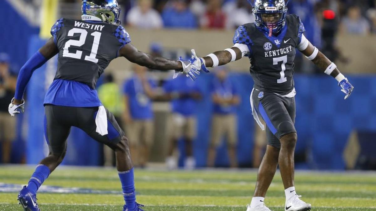 Kentucky safety Mike Edwards (7) celebrates after a third down stop with cornerback Chris Westry (21) during the first half of a 28-27 loss to Florida at Kroger Field on Saturday, September 23, 2017 in Lexington, KY.