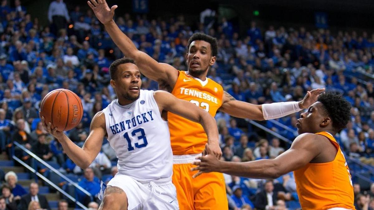 Kentucky guard Isaiah Briscoe, left, looks for an open teammate in the second half. The University of Kentucky hosted the University of Tennessee, Thursday, Feb. 18, 2016 at Rupp Arena in Lexington .