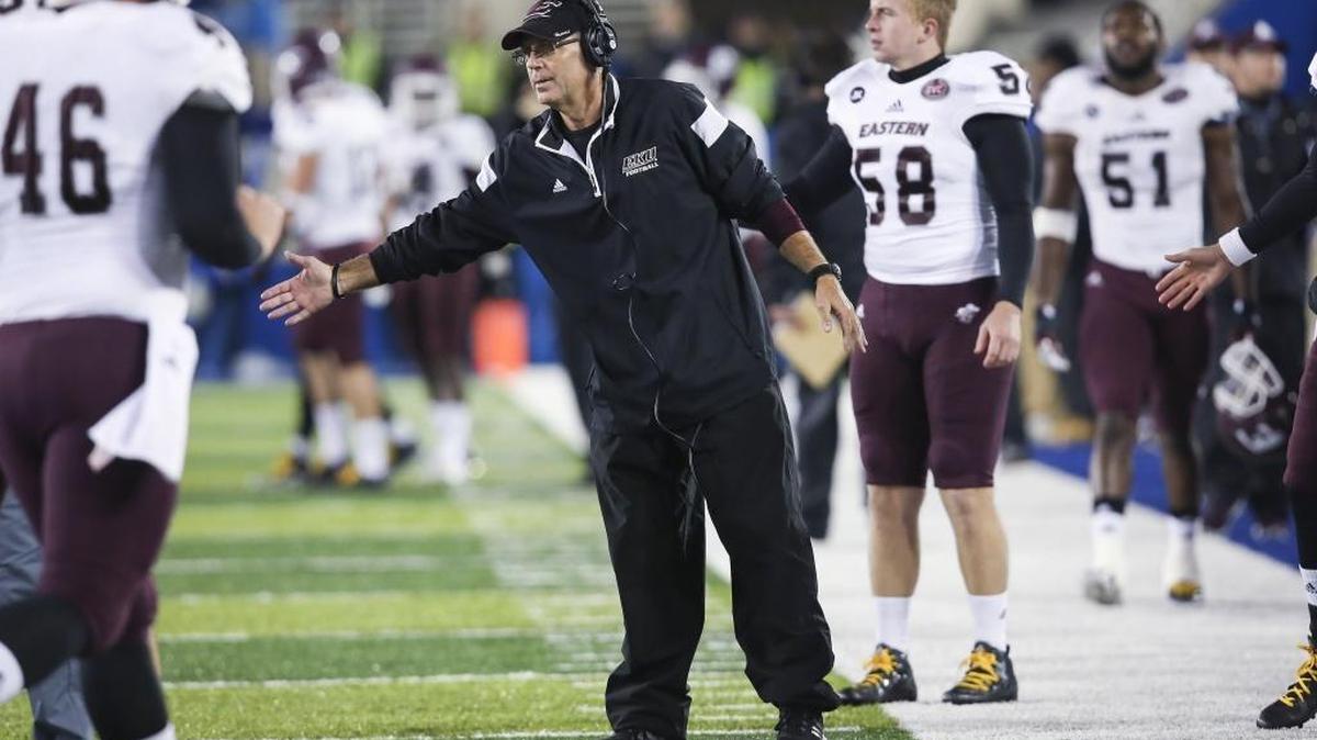 Eastern Kentucky head coach Dean Hood congratulates his team after they scored during the second half of an NCAA college football game against Kentucky, Saturday, Oct. 3, 2015, in Lexington, Ky. Kentucky won the game in overtime.