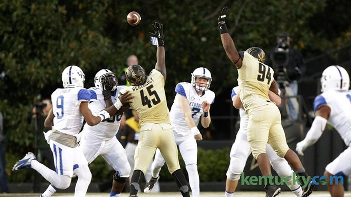 Kentucky quarterback Drew Barker throws a pass for Garrett Johnson in UK’s 21-17 loss at Vanderbilt on Nov. 14, 2015.