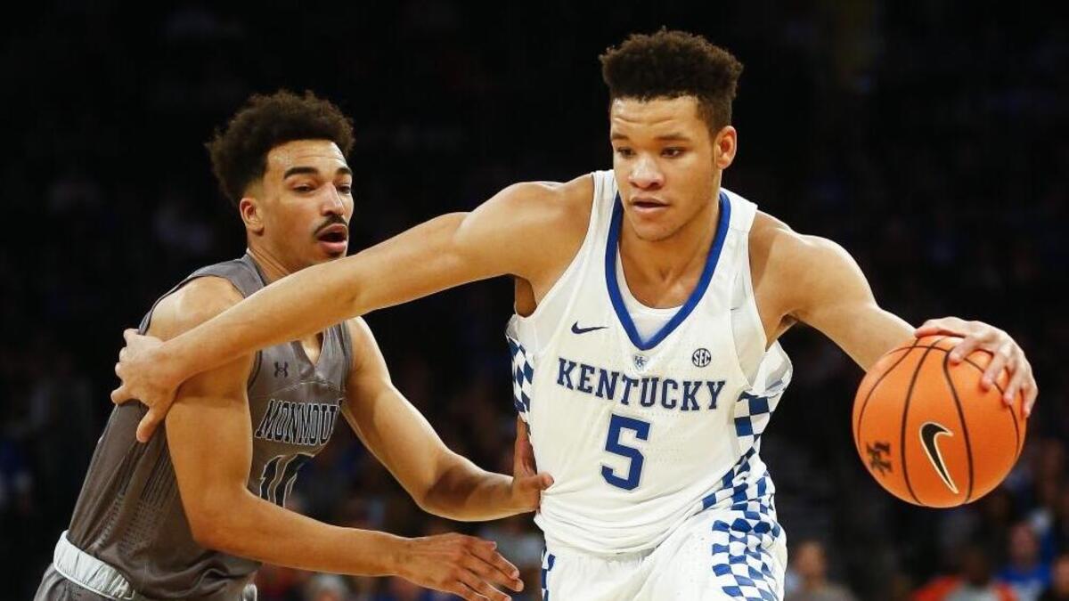 Kentucky forward Kevin Knox (5) drives past Monmouth guard Micah Seaborn (10) during UK’s 93-76 win in the Citi Hoops Classic at Madison Square Garden in New York, Saturday, Dec. 9, 2017.