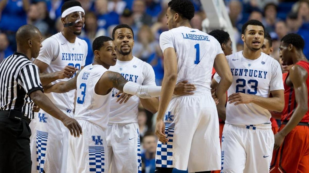 Kentucky guard Tyler Ulis, center, gathers his teammates during a foul situation in the first half. The University of Kentucky hosted Ole Miss, Saturday, Jan. 02, 2016 at Rupp Arena in Lexington.