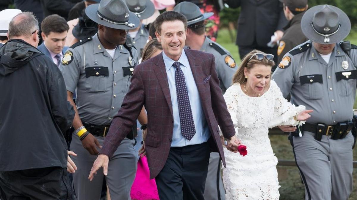 Louisville basketball head coach Rick Pitino, friends with the owner of the owners of Kentucky Derby winner Always Dreaming, signals the crowd after the colt, trained by Todd Pletcher, wins the 143rd running at Churchill Downs May 6, 2017.