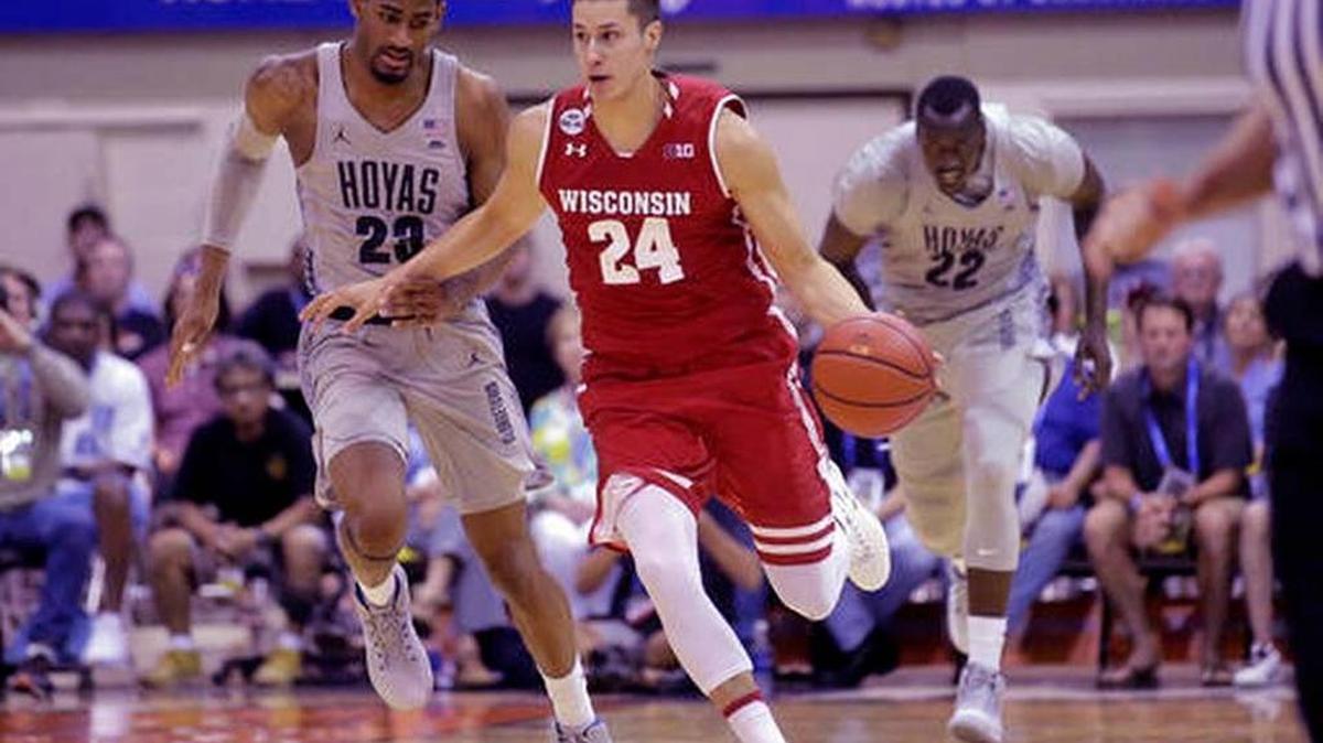 Georgetown’s Rodney Pryor (23) and Akoy Agau (22) pursue Wisconsin guard Bronson Koenig (24) in the second half during Wisconsin’s win in the Maui Invitational on Tuesday, Nov. 22, 2016, in Lahaina, Hawaii.