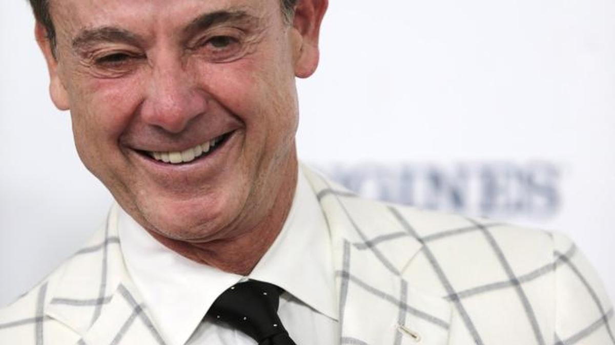 Louisville basketball coach Rick Pitino posed for the cameras on the Red Carpet on Derby Day at Churchill Downs in Louisville, Ky, on May 7, 2016.