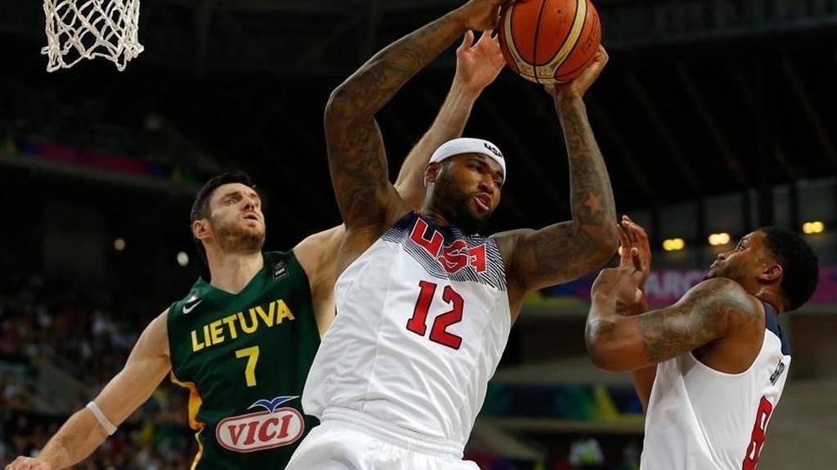 The United States’ DeMarcus Cousins,12, and Lithuania's Darjus Lavrinovic, 7, jump for the rebound during their Basketball 2014 World Cup semifinal match at the Palau Sant Jordi in Barcelona, Spain.