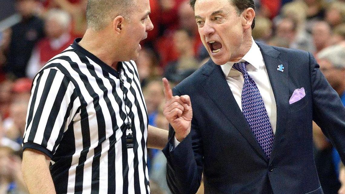 Louisville head coach Rick Pitino, right, argues with referee Brian Dorsey during the second half of an NCAA college basketball game against Duke, Saturday, Feb. 20, 2016 in Louisville Ky. Louisville won 71-64.