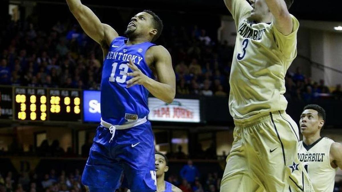 Kentucky Wildcats guard Isaiah Briscoe (13) went past Vanderbilt Commodores forward Luke Kornet (3) for a basket during UK’s 74-62 loss at Vanderbilt on Saturday, Feb. 27, 2016.