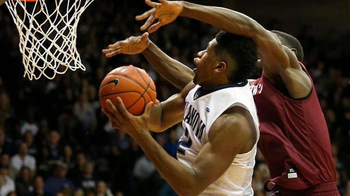 Villanova forward Kris Jenkins (2) is fouled by Saint Joseph's forward Markell Lodge (23) in the second half of Villanova’s 88-57 win, Saturday, Dec. 3, 2016, in Villanova, Pa.