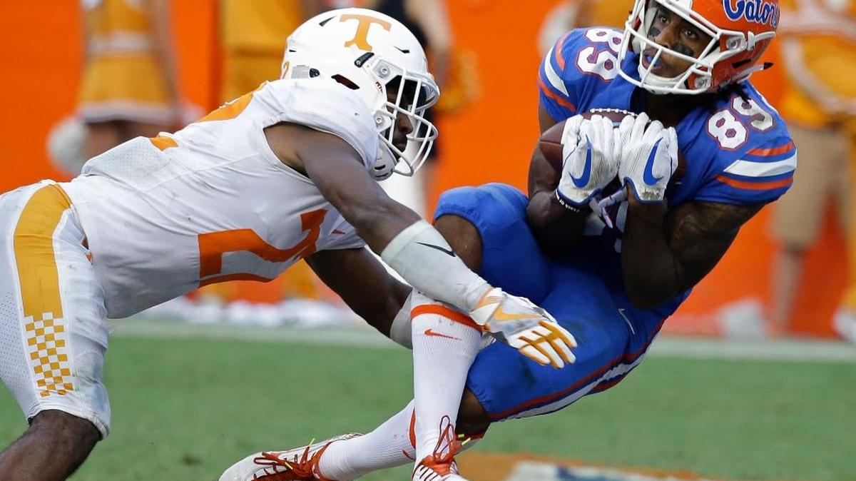Florida wide receiver Tyrie Cleveland, right, catches the game winning 63-yard touchdown pass in front of Tennessee defensive back Micah Abernathy (22) as time expired in the Gators’ 26-20 victory over the Volunteers on Saturday, Sept. 16, 2017, in Gainesville, Fla. Florida travels to Kentucky on Sept. 23, 2017.