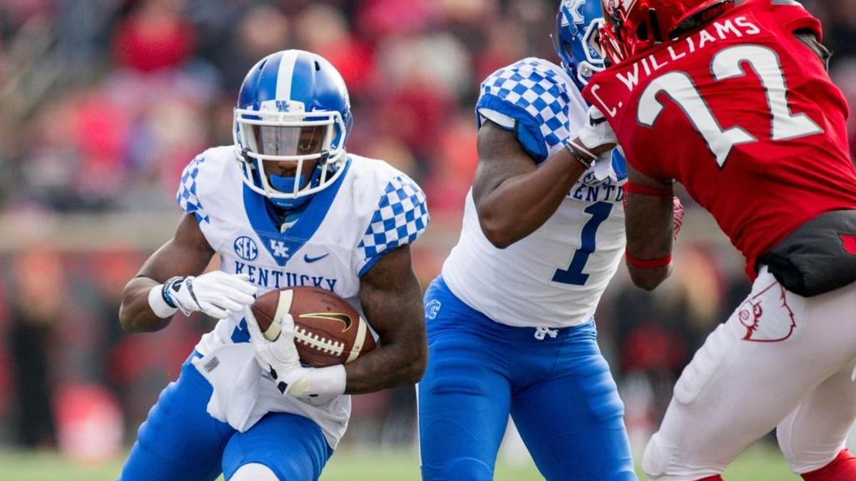 Kentucky wide receiver Jeff Badet runs for yardage in the second half of UK’s 41-38 win over Louisville on Saturday, Nov. 26, 2016 at Papa John’s Cardinal Stadium in Louisville.