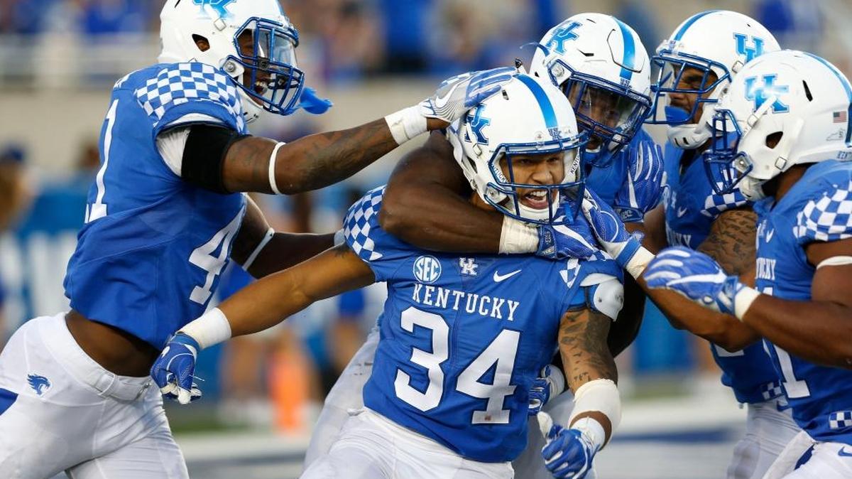 Kentucky linebacker Jordan Jones (34) was mobbed by teammates after a fourth-quarter quarterback sack in UK’s 20-13 win over Vanderbilt at Commonwealth Stadium in Lexington, Ky., Saturday, October 8, 2016.