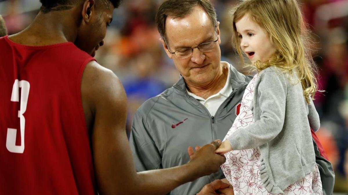 Oklahoma head coach Lon Kruger holds his granddaughter Avery Ciklin during a practice session for the NCAA Final Four college basketball tournament Friday, April 1, 2016, in Houston.