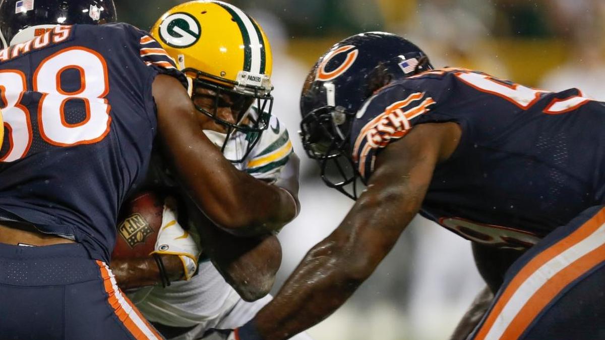 Green Bay Packers wide receiver Davante Adams is hit by Chicago Bears defenders Adrian Amos and Danny Trevathan during the second half of an NFL football game Thursday, Sept. 28, 2017, in Green Bay, Wis. The Bears were penalized on the play and Adams was taken off the field on a stretcher.