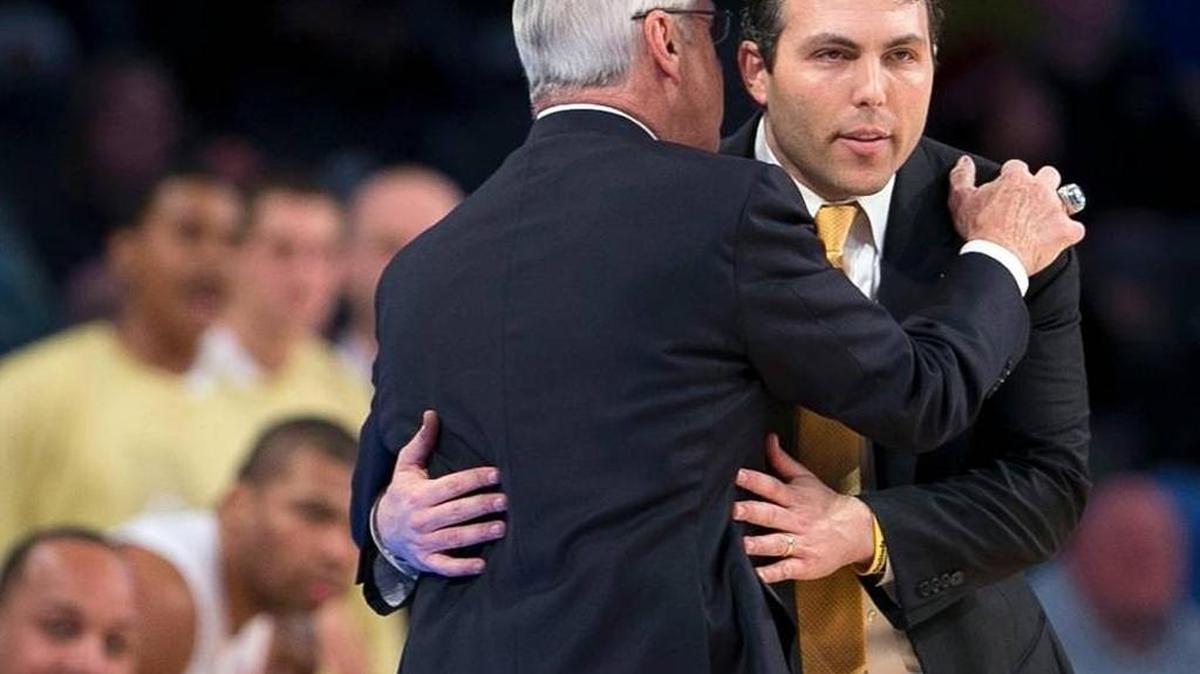 North Carolina coach Roy Williams congratulates Georgia Tech coach Josh Pastner after Georgia Tech knocked off UNC 75-63 in Atlanta on Saturday, Jan. 31, 2016.