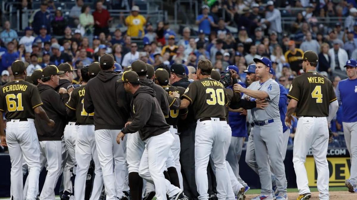 The San Diego Padres and the Los Angeles Dodgers come onto the field during an argument during the second inning of a baseball game Friday, June 30, 2017, in San Diego. Padres manager Andy Green, former UK baseball star, and Dodgers manager Dave Roberts had their own confrontation.