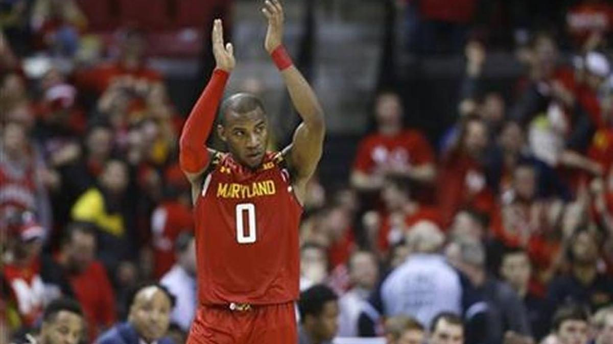 Maryland guard Rasheed Sulaimon applauds in the final moments of an NCAA college basketball game against Purdue, Saturday, Feb. 6, 2016, in College Park, Md. Sulaimon contributed a game-high 21 points to Maryland's 72-61 win.
