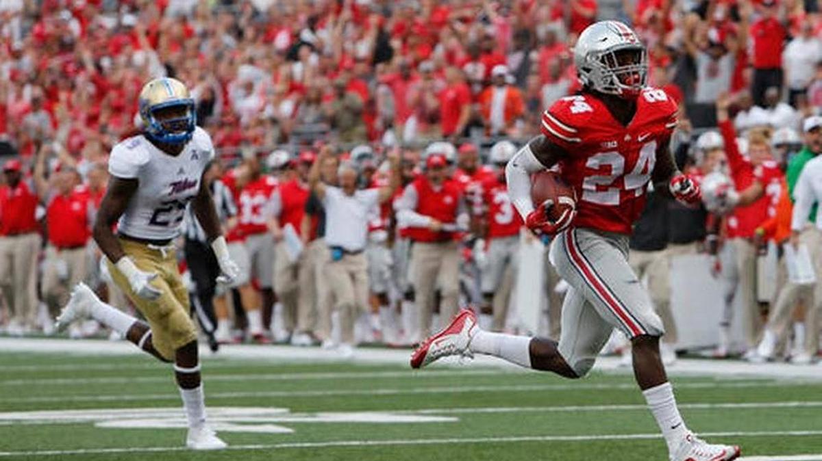 Ohio State safety scores a touchdown after intercepting a pass against Tulsa during the first half of an NCAA college football game, Saturday, Sept. 10, 2016, in Columbus, Ohio.