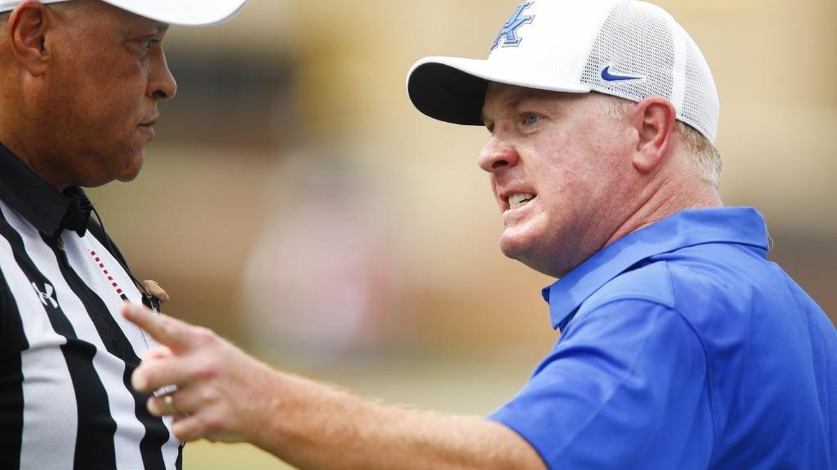 Kentucky head coach Mark Stoops argues with referee Hubert Owens during UK’s 24-17 win over the Southern Miss Golden Eagles at M.M. Roberts Stadium in Hattiesburg, Miss., Saturday, Sept. 2, 2017.