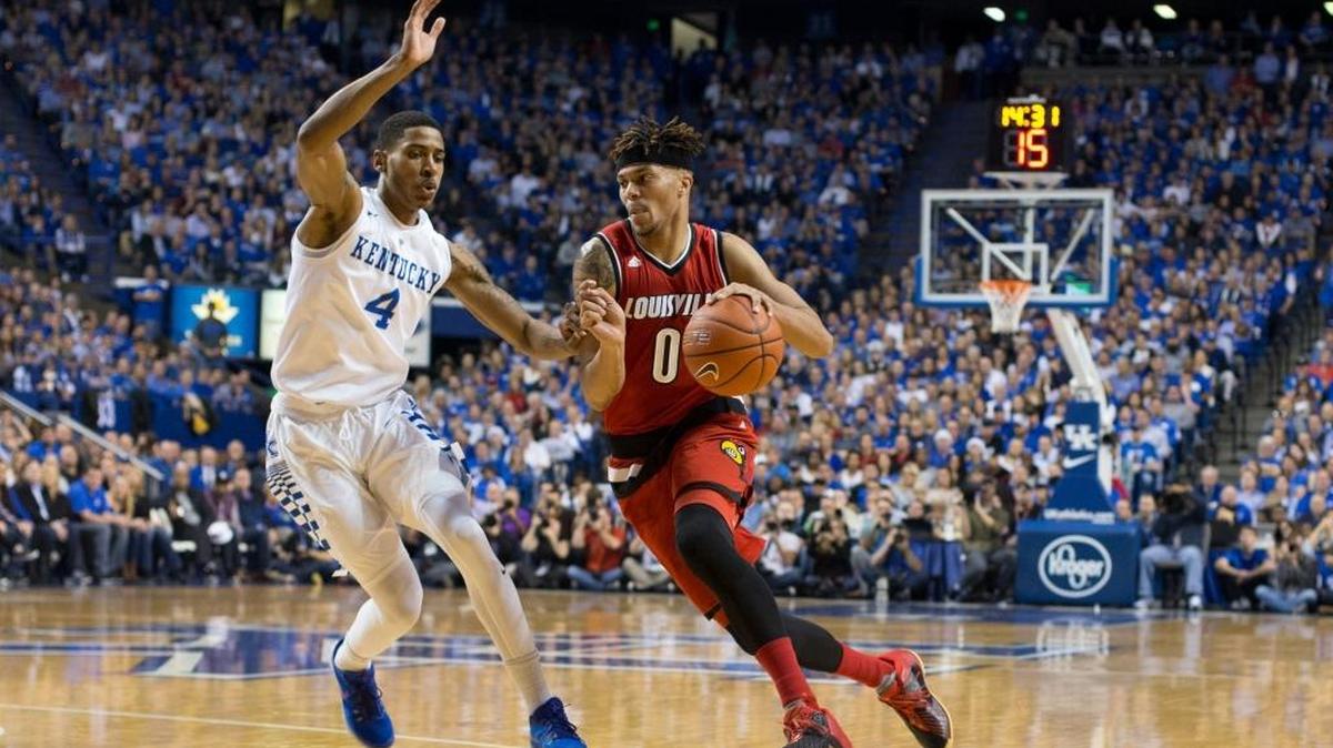 Louisville guard Damion Lee, right, drives to the basket with pressure from Kentucky guard Charles Matthews in the first half. The University of Kentucky hosted the University of Louisville, Saturday, Dec. 26, 2015 at Rupp Arena in Lexington.