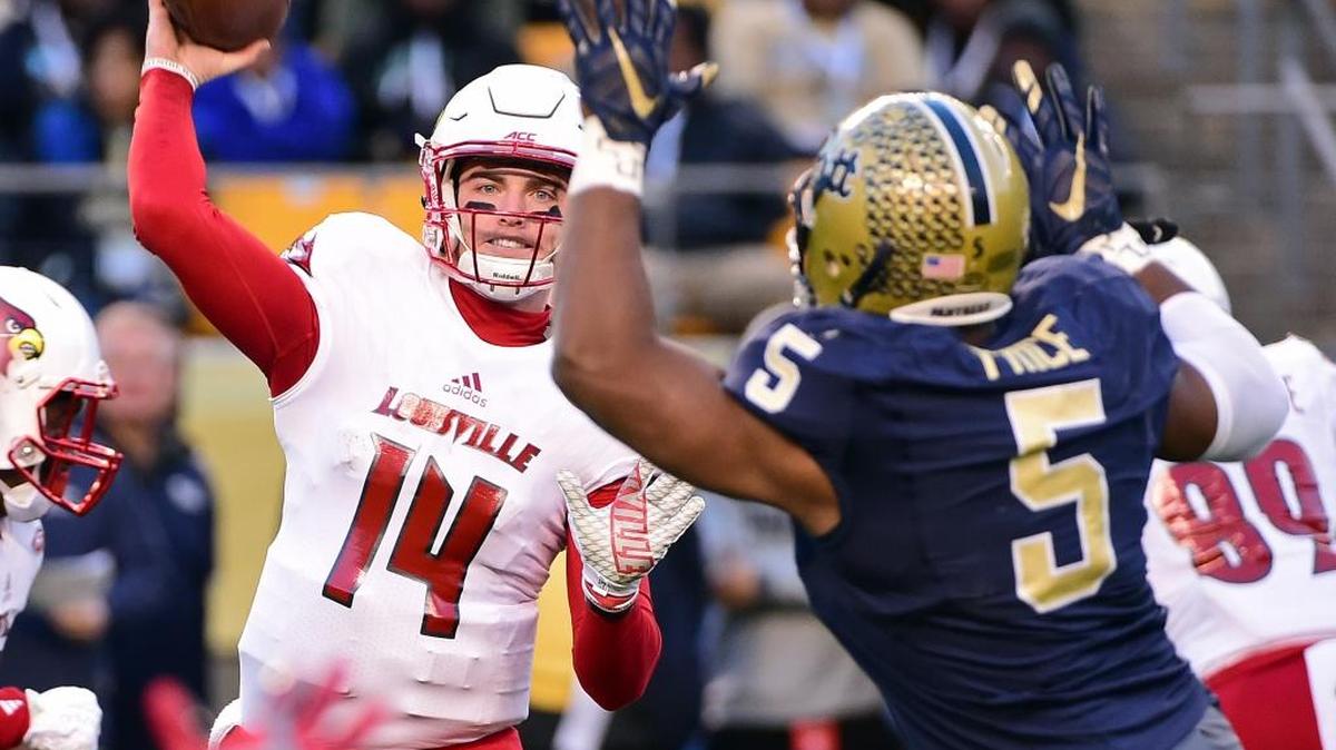 Louisville quarterback Kyle Bolin (14) throws a pass as Pittsburgh defensive lineman Ejuan Price (5) defends during the first half of an NCAA college football game, Saturday, Nov. 21, 2015 in Pittsburgh.