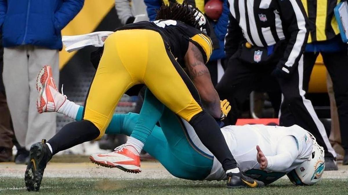 Pittsburgh Steelers outside linebacker Bud Dupree, top, hits Miami Dolphins quarterback Matt Moore (8) during the first half of Pittsburgh’s 30-12 win in the AFC wild-card NFL football game in Pittsburgh, Sunday, Jan. 8, 2017.