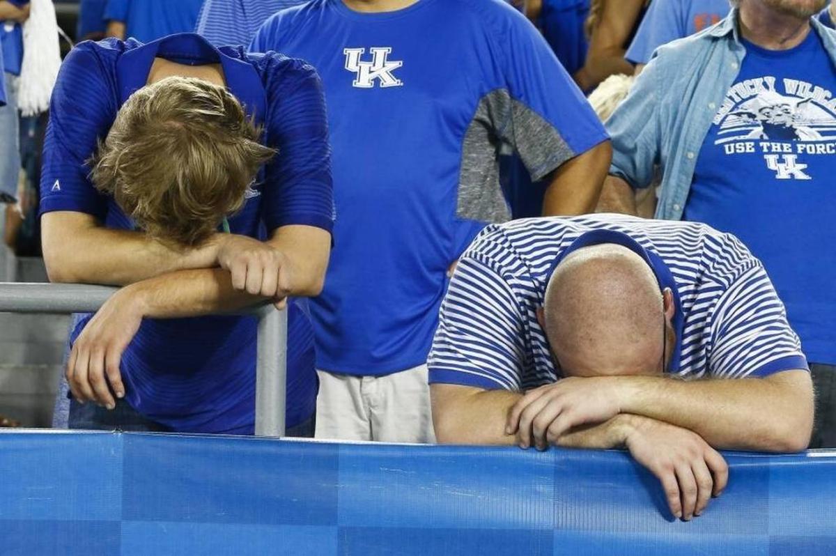 Kentucky fans were in agony after UK blew a 27-14 lead in the fourth quarter and lost to Florida 28-27, the Wildcats’ 31st straight loss to the Gators.