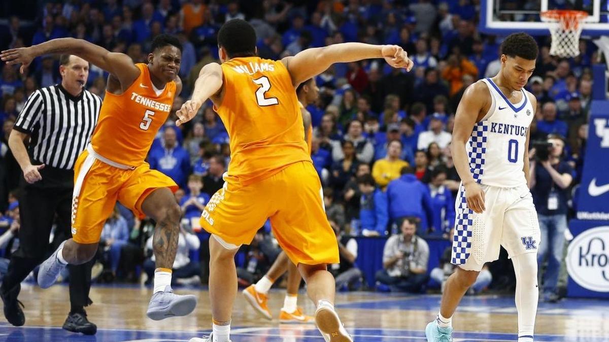 Kentucky guard Quade Green (0) appeared dejected as Tennessee forwards Admiral Schofield (5) and Grant Williams (2) celebrated late in the second half of the Volunteers’ 61-59 victory over the Wildcats on Tuesday, Feb. 6, 2018 at Rupp Arena.
