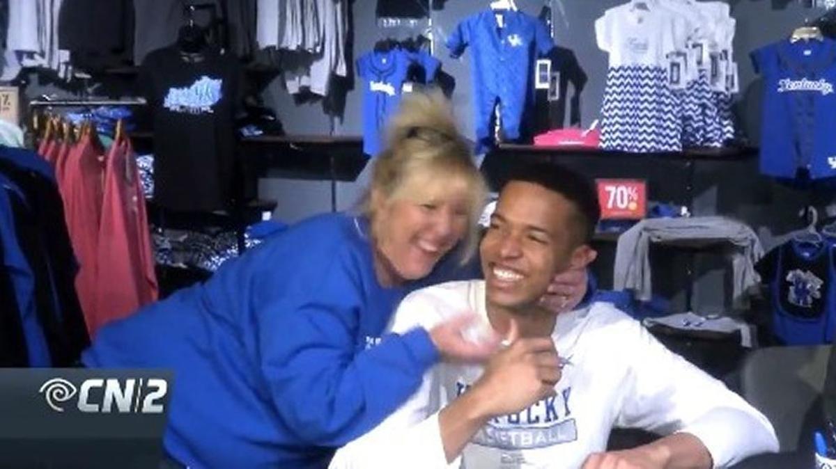 Former UK center received hugs and more from a happy Wildcats fan during a recent autograph session.