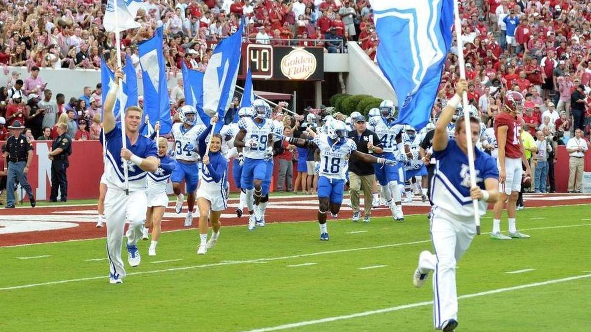 Kentucky’s Boom Williams leads team on the field last week at Alabama. UK lost 34-6 to the top-ranked Tide. The Cats play Vanderbilt this Saturday at Commonwealth Stadium.