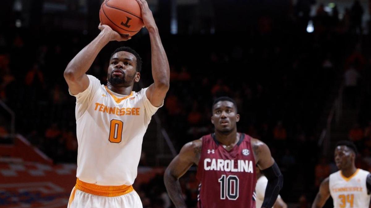 Tennessee guard Kevin Punter (0) shoots a free throw in the final seconds of the second half of an NCAA college basketball game as South Carolina guard Duane Notice (10) looks on Saturday, Jan. 23, 2016, in Knoxville, Tenn. Tennessee won 78-69.