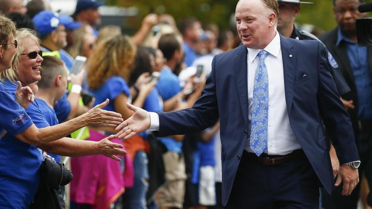 Kentucky head football coach Mark Stoops greets fans during the Catwalk before his team’s 40-34 win over the Missouri Tigers at Kroger Field in Lexington, Ky., Saturday, Oct. 7, 2017.