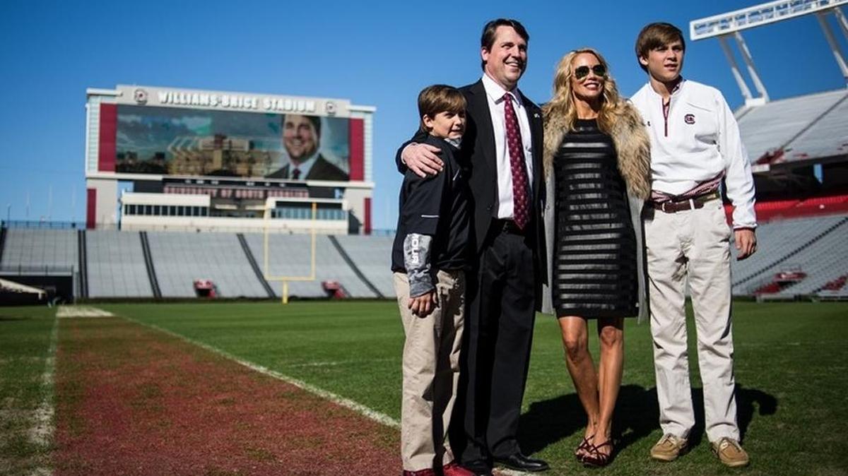 New South Carolina football coach Will Muschamp poses with his family at Williams Brice Stadium.